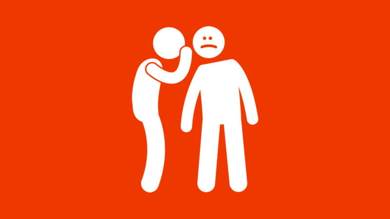 One figure whispering into another figure's ear