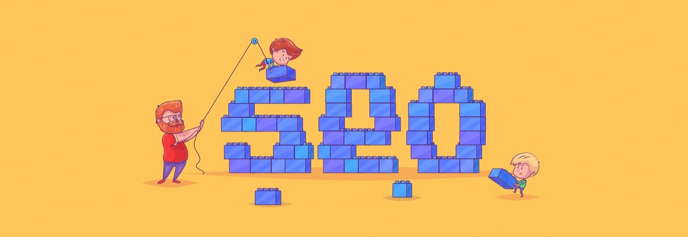 An adult and two children building large lettering from toy bricks